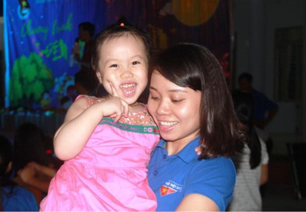 A little girl’s cheerful face as enjoying a lion dance 