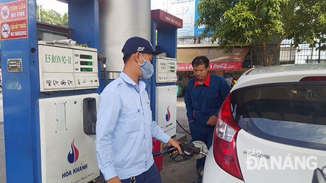 A local customer has his car filled up with E5 bio-fuel