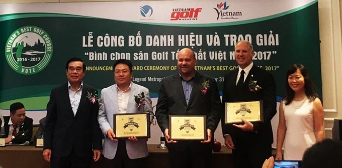 Bà Nà Hills GM Tim Haddon (middle) accepts the award for Việt Nam’s Best New Course 2016-2017. — Photo courtesy of Bà Nà Hills Golf Club Read more at http://vietnamnews.vn/sports/416714/ba-na-hills-golf-club-wins-national-award.html#2X8DyPAwSgTip64Z.99