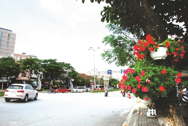 A local major street decorated with colourful flowers