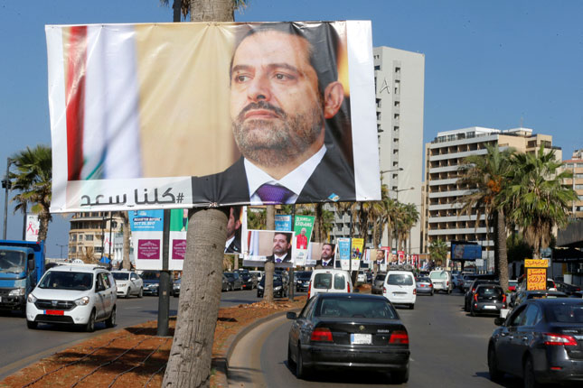 Nhiều áp-phích in chân dung Thủ tướng Lebanon Saad al-Hariri treo tại thủ đô Beirut của Lebanon. 					Ảnh: Reuters