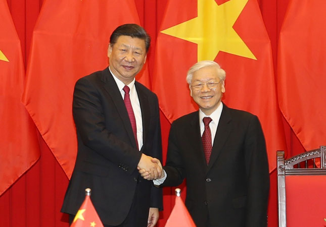 Tổng Bí thư Nguyễn Phú Trọng và Tổng Bí thư, Chủ tịch Trung Quốc Tập Cận Bình. 		                        Ảnh: TTXVN