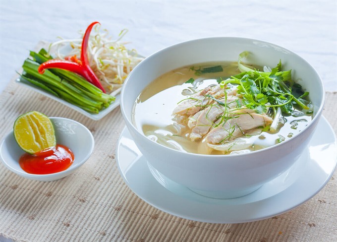 New soup on the block: Phở gà (chicken noodle), a variation of the dish created due to the lack of beef supply. Read more at http://vietnamnews.vn/life-style/419209/more-than-a-bowl-of-noodles-pho-is-history.html#q65zfGKsHVuz84Q7.99