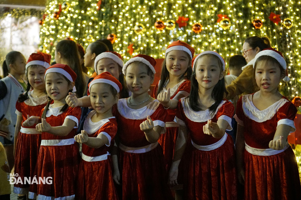 Local children eagerly wearing Christmas costumes