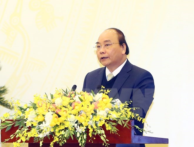 PM Nguyen Xuan Phuc speaks at the Government meeting on December 28 (Photo: VNA)