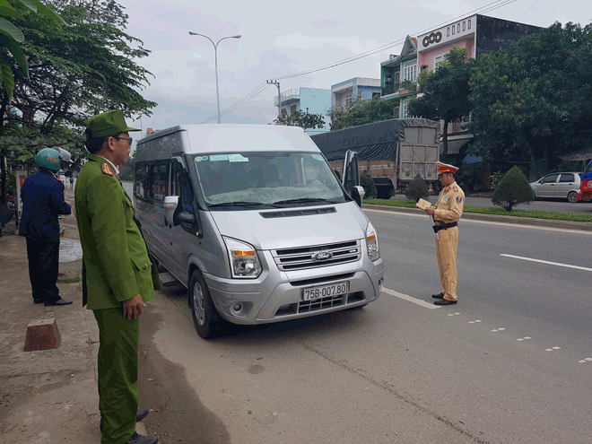 Local police officers performing a check over a 16-seater vehicle