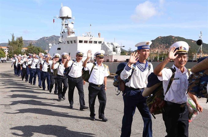 Goodbye: Naval soldiers wave farewell to their family and relatives before setting out to take on new missions on Trường Sa (Spratly) Islands. — VNA/VNS Photo Quang Quyết Read more at http://vietnamnews.vn/life-style/421167/tet-gifts-from-the-mainland-arrive-at-truong-sa-island.html#PYxsihvuqSCBvfhZ.99