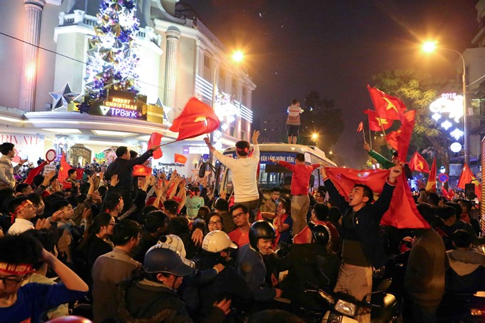 Glory achieved: Hanoian fans take to the streets to savour Việt Nam’s win. — VNA/VNS Photo Thành Đạt Read more at http://vietnamnews.vn/sports/421583/viet-nam-make-history-shock-asia.html#1Dzv3Jlp790o7WKI.99