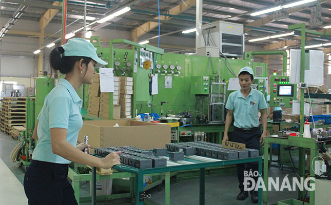 Workers at the Tokyo Keiki Precision Technology Company