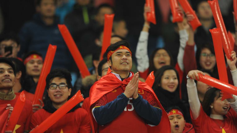  A large number of Vietnamese fans cheering for the team 