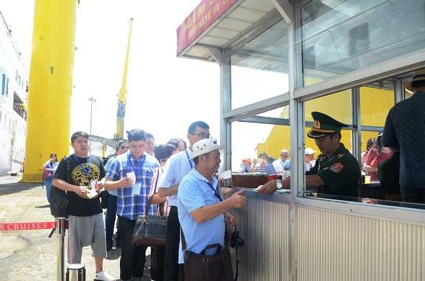 Cruise ship passengers taking immigration procedures at the port