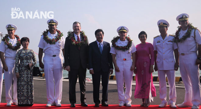 Representatives from the municipal Department of Foreign Affairs and some of the crew members onboard the USS Carl Vinson