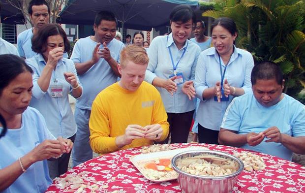  … whilst another one (in yellow T-shirt) participating in a garlic peeling contest with some patients at the Da Nang Nursing Centre for the Mentally Ill