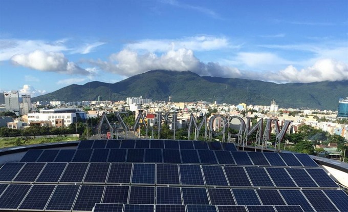 A roof-top solar power system is installed on a trading centre in Đà Nẵng. The city has launched a pilot project in energy management, the Calculator 2050 with funding from the UK. — VNS Photo Minh Vũ Read more at http://vietnamnews.vn/society/423961/da-nang-launches-energy-planning-project.html#UIwGVthogTadQ0Md.99