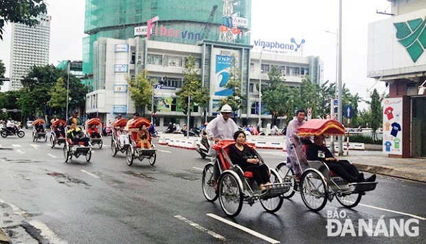 Visitors enjoying a city tour by cyclo