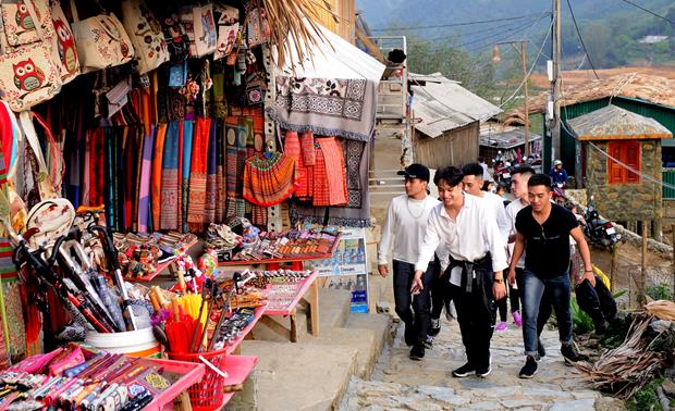   Visitors waking around the village