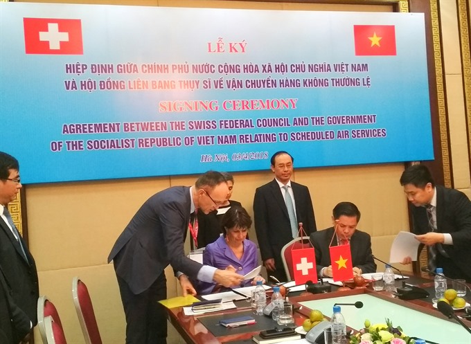 Transport Minister Nguyễn Văn Thể and Federal Councilor of Switzerland Doris Leuthard sign the agreement on scheduled air services Tuesday afternoon. — VNS Photo Bích Hường Read more at http://vietnamnews.vn/society/425674/direct-flights-from-switzerland-to-viet-nam-reopened-in-november.html#FB0usZGpVdZK3SPF.99