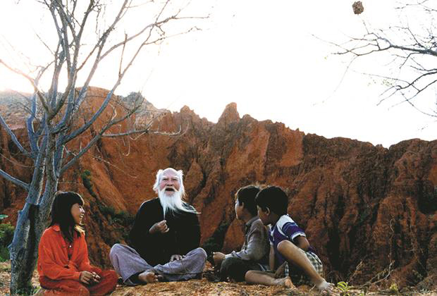 A senior man and his grandchildren