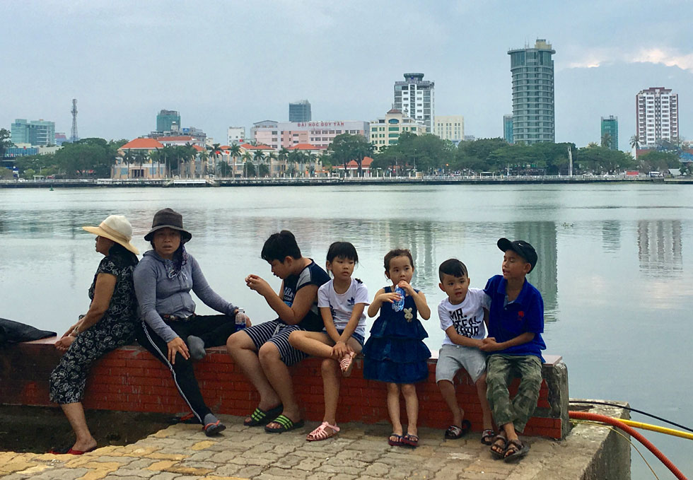  Local families choosing premiere vantage points for viewing fascinating fireworks performances along the both banks of the river