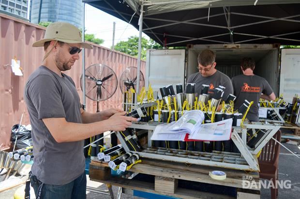 Despite hot weather, Sweden team members trying their best efforts to ensure on-schedule installation of their fireworks