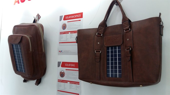  Fashionable: Bags with solar panels. The pack will provide clean energy for mobile phones and portable electronic devices. — VNS Photo Công Thành Read more at http://vietnamnews.vn/sunday/features/450333/da-nang-lights-up-with-solar-power.html#HGZci66u7ybYAdz3.99