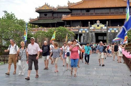 Foreign tourists visit Hue Imperial City.