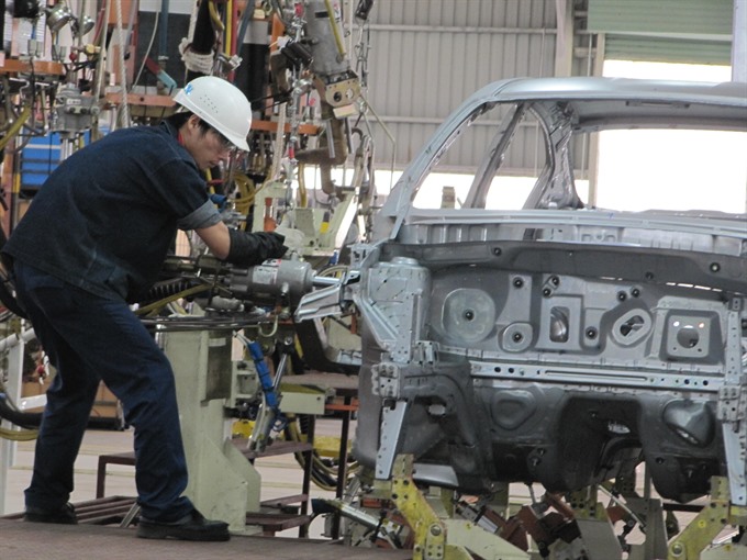 An engineer works at the Nissan automobile plant in Đà Nẵng. Japan is seeking manpower from central Việt Nam to work in the Japanese market. — VNS Photo Công Thành 