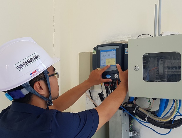 An employee checking the plant’s control system 