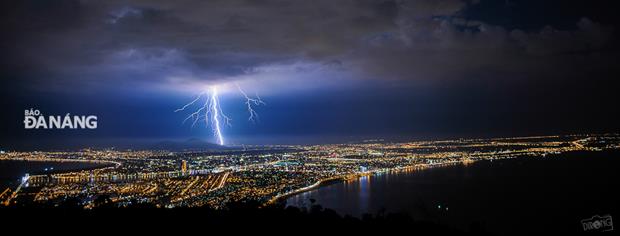 Flash of lighting in the night sky above the city