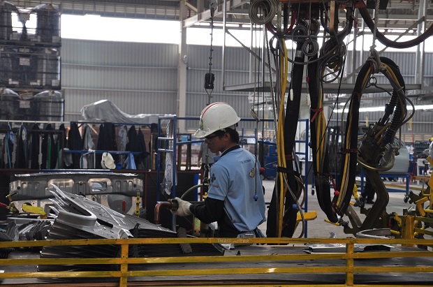 A worker at the Nissan automobile factory in the Hoa Khanh Industrial Park