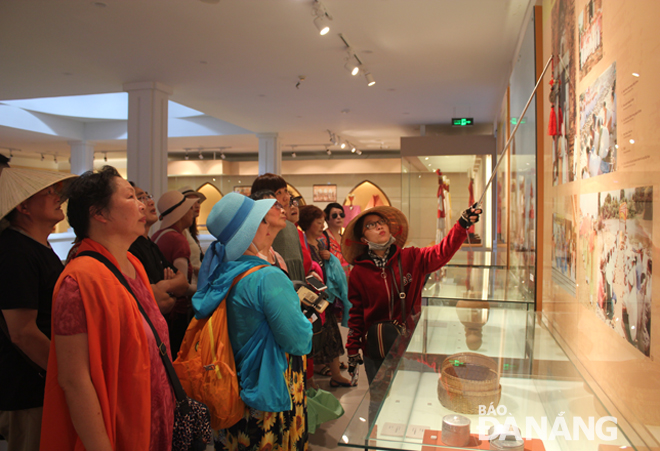 Visitors admiring valuable Cham exhibits on display at the museum   