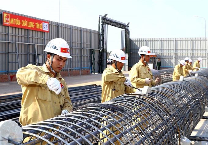 Vietnamese workers at the construction site of Lao National Assembly building, considered a symbol of friendship between the two neighbouring countries.