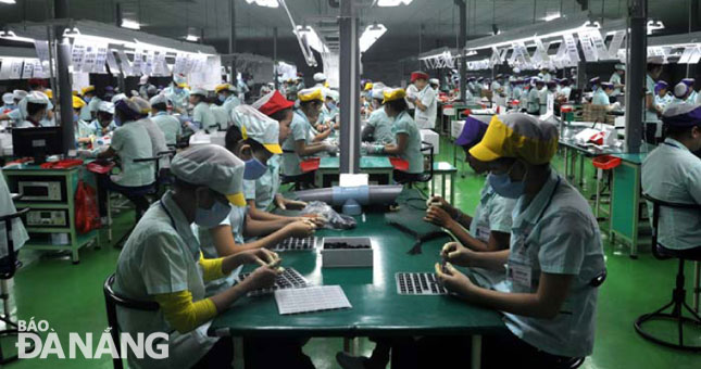 Workers at the Da Nang Foster Electric Company.