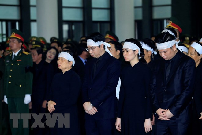Gia đình, họ hàng nội ngoại Chủ tịch nước Trần Đại Quang tại lễ truy điệu. (Ảnh: Nhan Sáng/TTXVN)