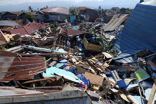 Houses were damaged in Palu, Indonesia's Central Sulawesi on October 1, 2018, after an earthquake and tsunami hit the area on September 28. (Photo: AFP/VNA)