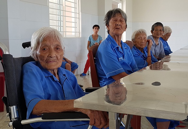 Mrs Nguyen Thi Lan (left) being cared at the new centre for social protection 