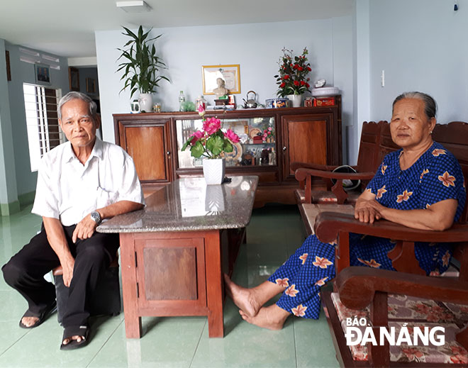 Mr Thong and his wife in their newly-repaired house