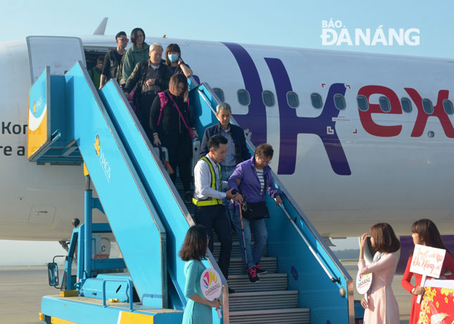 Foreign visitors onboard a direct flight from Hong Kong to Da Nang which is  operated by HK Express, Hong Kong’s first and only low-cost carrier