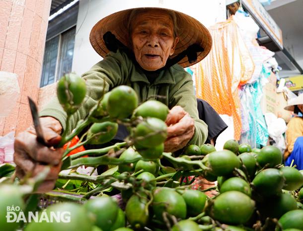 A bunch of fresh areca nuts is on sale