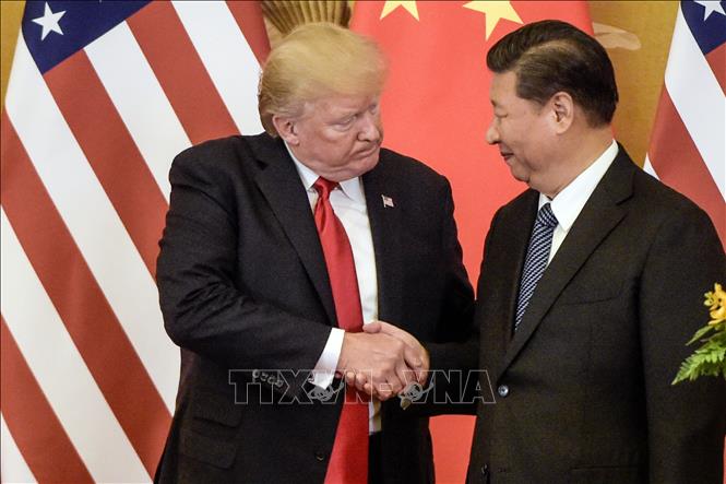 Tổng thống Mỹ Donald Trump (trái) và Chủ tịch Trung Quốc Tập Cận Bình trong cuộc gặp tại Bắc Kinh ngày 9/11/2017. Ảnh tư liệu: AFP/TTXVN