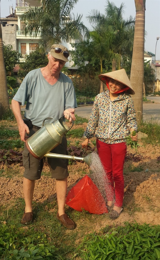 Farm hand: Keenan helps farm at Friendship Village in Hà Nội. Read more at http://vietnamnews.vn/life-style/expat-corner/481412/american-vet-finds-peaceful-home-in-da-nang.html#7TkySf5ACT6xpY76.99