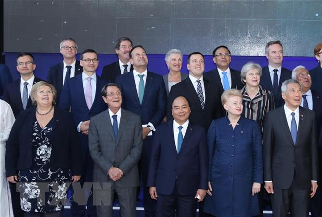 Thủ tướng Nguyễn Xuân Phúc và các Trưởng đoàn dự Phiên họp toàn thể thứ hai của ASEM 12, sáng 19/10/2018, tại Brussels (Bỉ). (Ảnh: Thống Nhất/TTXVN)