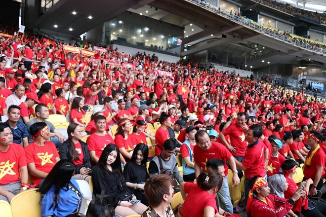 Vietnamese football fans at the final first-leg of the AFF Suzuki Cup at Bukit Jalil stadium in Kuala Lumpur (Photo VNA)