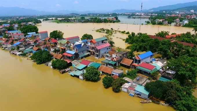 A severe flood hit Bùi Xá Village in Hà Nội’s Chương Mỹ District in July.— VNA/VNS Photo Nguyễn Thắng Read more at http://vietnamnews.vn/environment/482569/natural-disasters-kill-218-cost-vn-860m.html#Gxj6q1c8JLsI0FTz.99