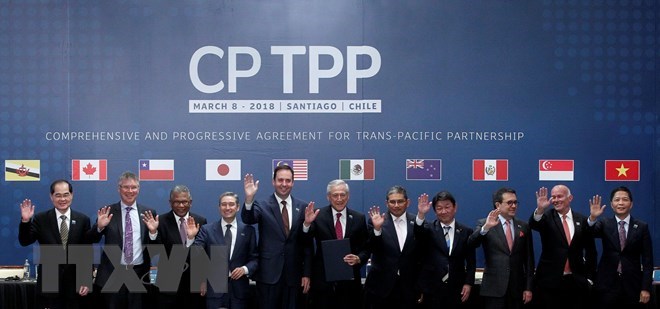 Officials of the CPTPP members pose for a photo at the agreement signing event in Chile last March (Photo: AFP/VNA)