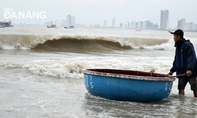 A local fisherman is finding a suitable anchorage location for his coracle boat