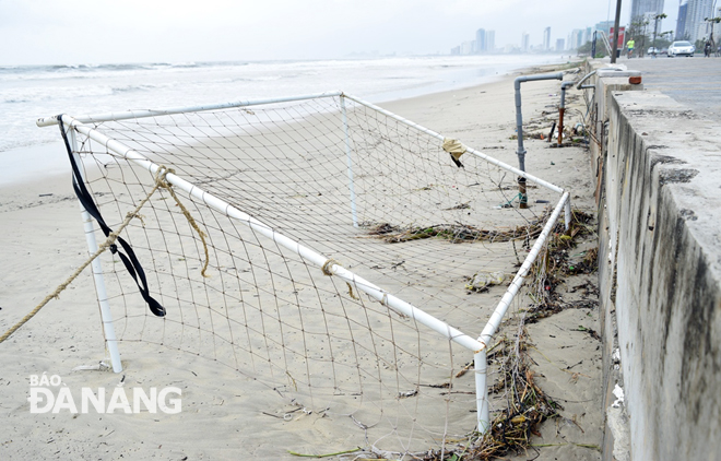 Beach sports equipment is washing up on a beach.