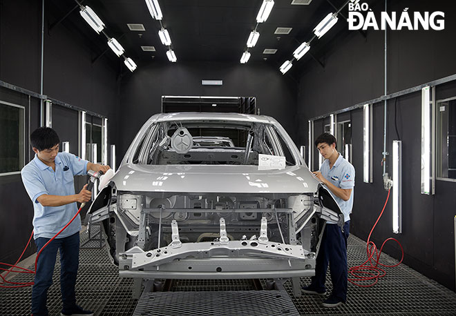 Workers at the Nissan automobile factory in the Hoa Khanh Industrial Park.