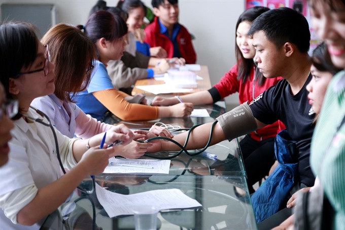 Students from the city-based Dong A University donate blood during a voluntary campaign in 2019.