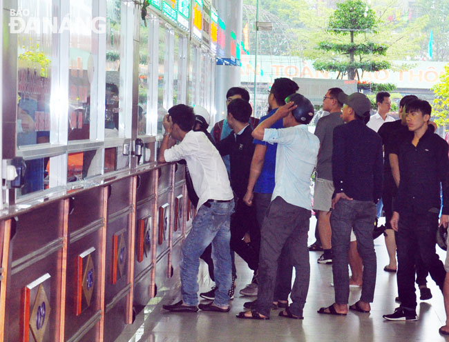 Passengers standing in line to purchase tickets at the city’s inter-provincial coach station.